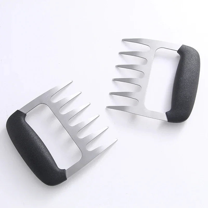 Pair of stainless steel BBQ meat shredders with black handles on white background